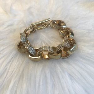 Chunky gold linked bracelet.
